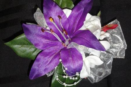 Vibrant purple lily corsage.