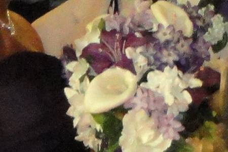 Brides bouquet...purple lilies, ivory roses and calla lilies!