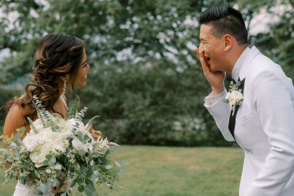 Bride and groom confetti kiss