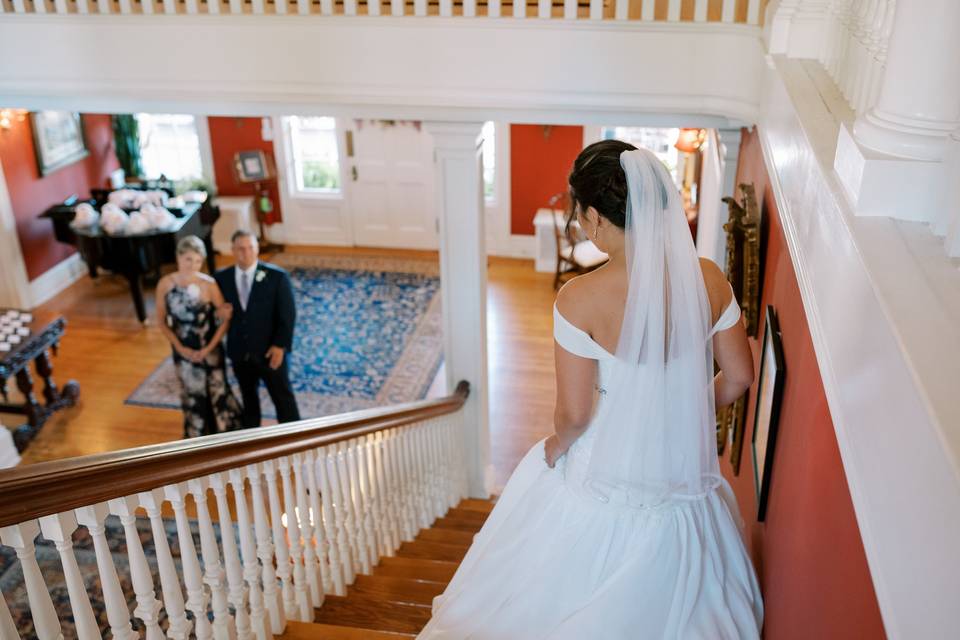 Father helps bride into car