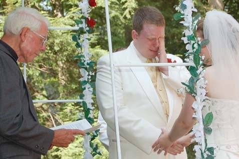 At the outdoor Alter the groom cries ears of joy.