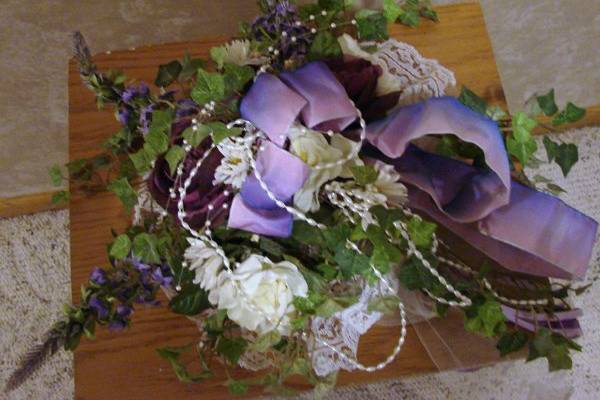 of english ivy, accented with mauve and blue flowers