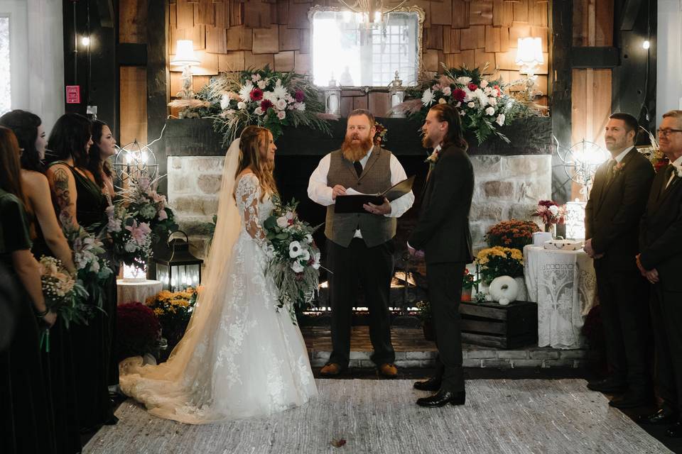 Ceremony in front of fireplace