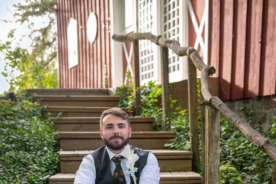 Groom on front stairway