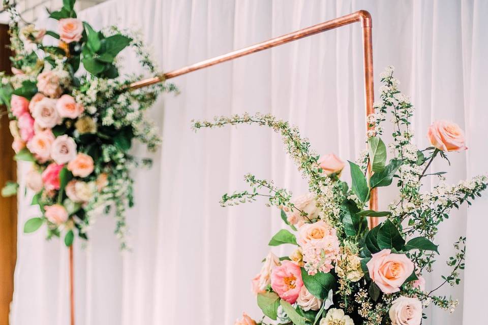 Copper arch ceremony flowers