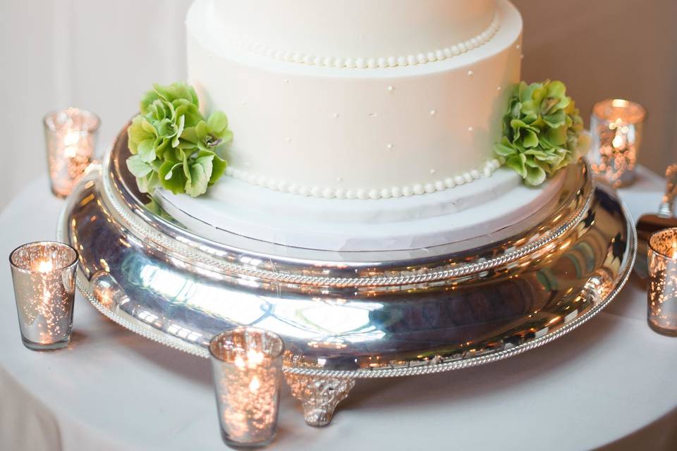 Four tier wedding cake with green flowers