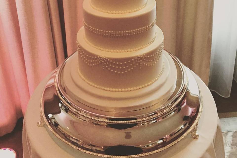 Four tier tall wedding cake