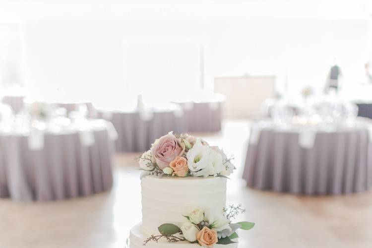 Three tier wedding cake with flowers