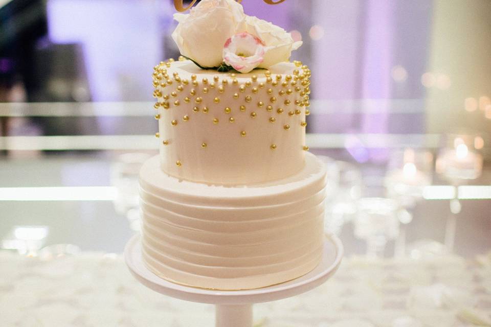 Two tier wedding cake with love on top