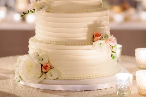 Four tier wedding cake with white flowers