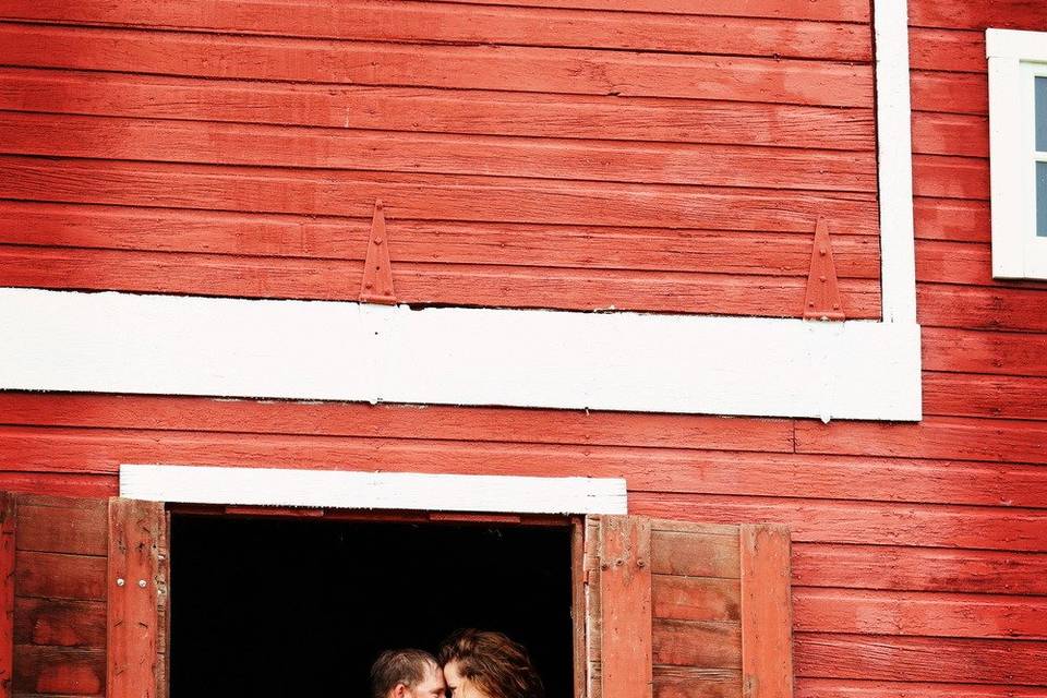 Engagement photo in a barn window