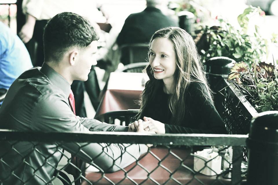 Couple seated at a table chatting