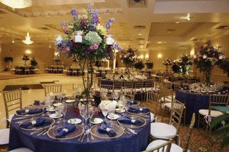Table setting with tall floral centerpiece