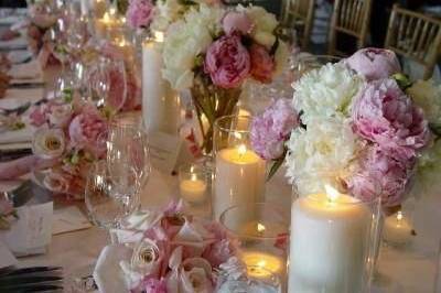 Table setting with floral and candle centerpiece