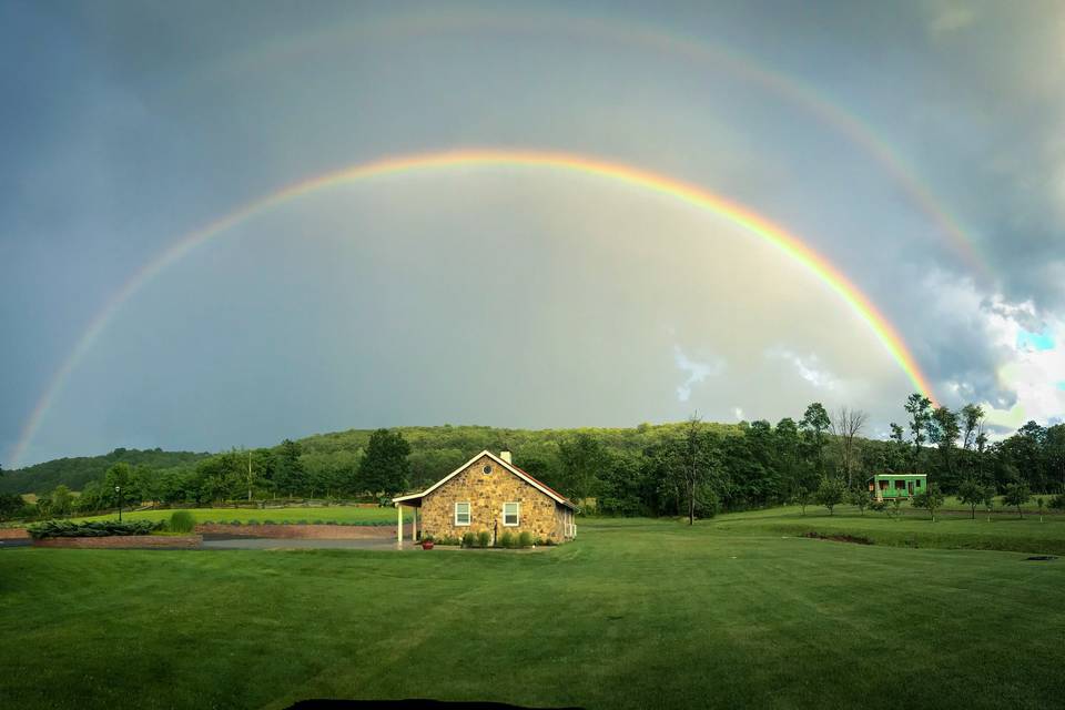 Rainbow over barn