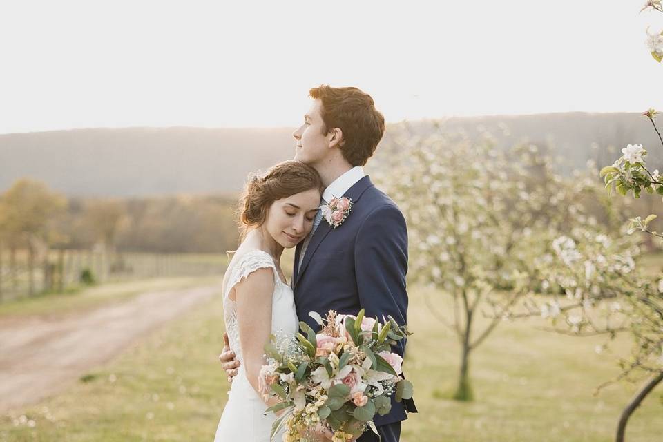 Couple by the orchard