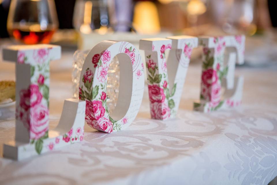 Romantic signage decorated with roses