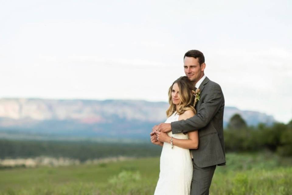 Couple posing in field