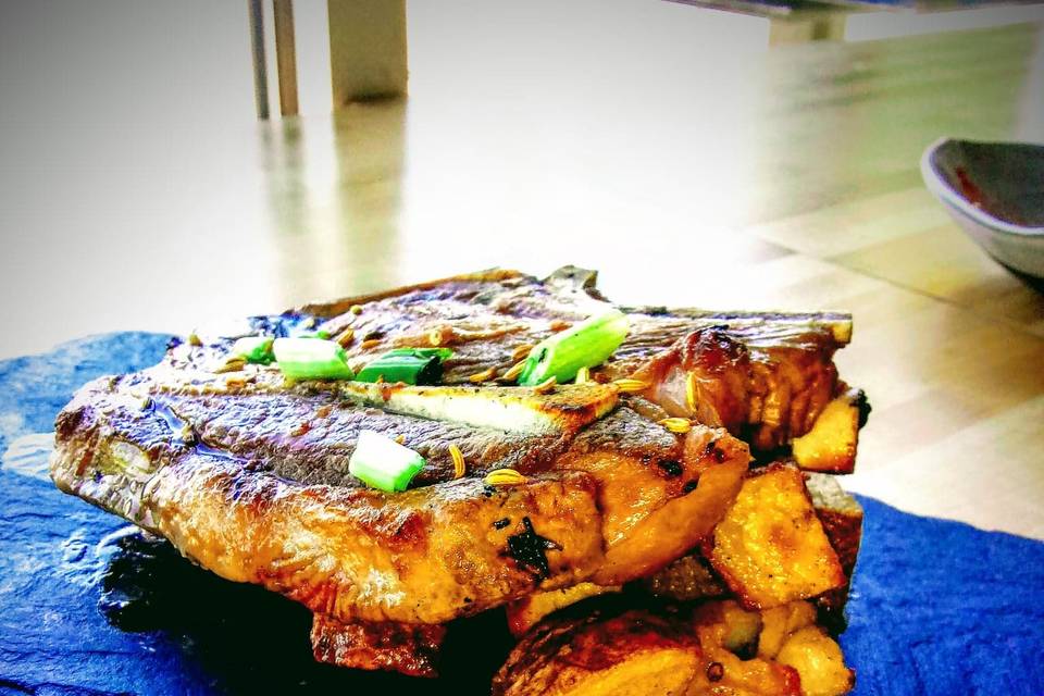 T-Bone on a bed of potatoes