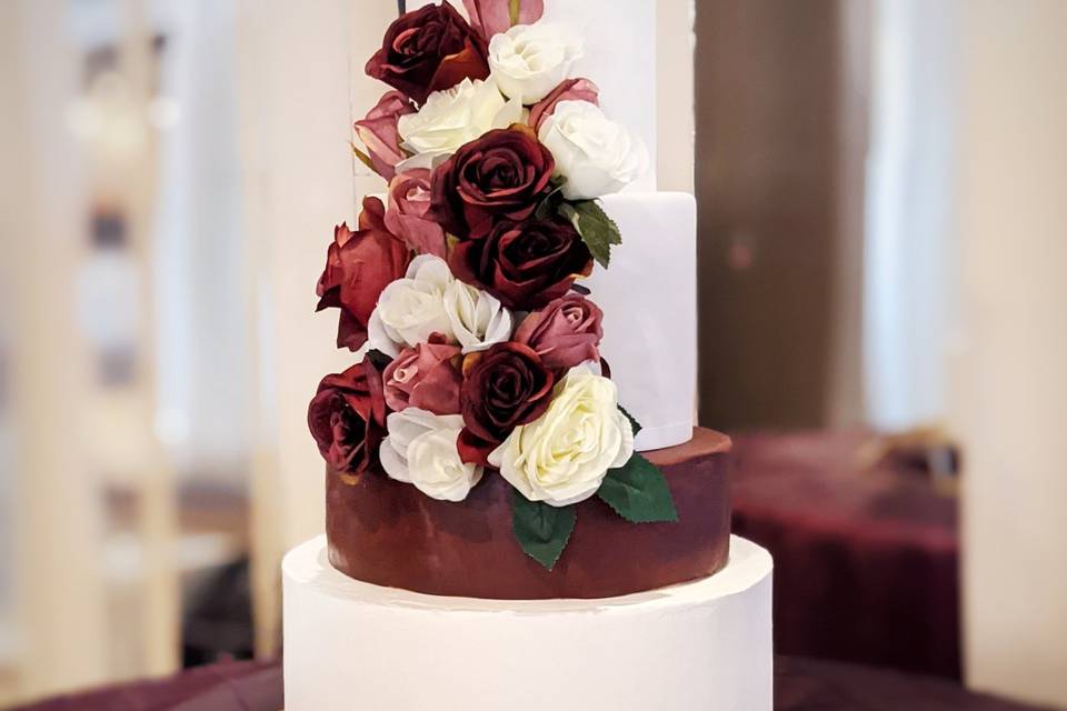 Ivory and burgundy wedding cak