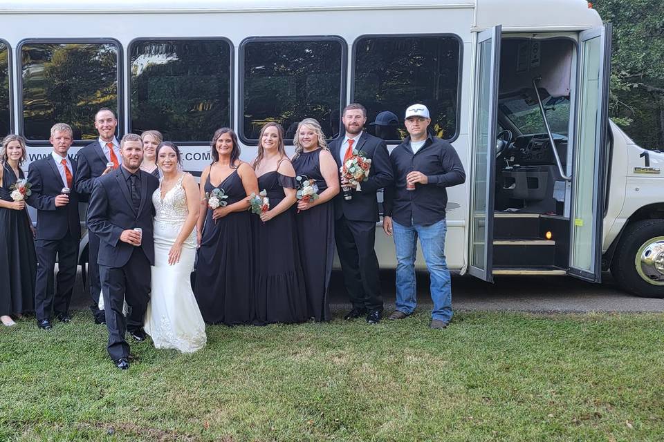 Wedding party with bus