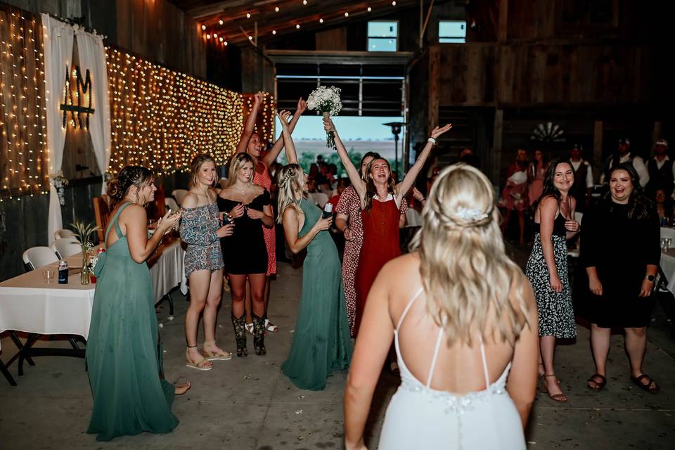 She caught the bouquet!