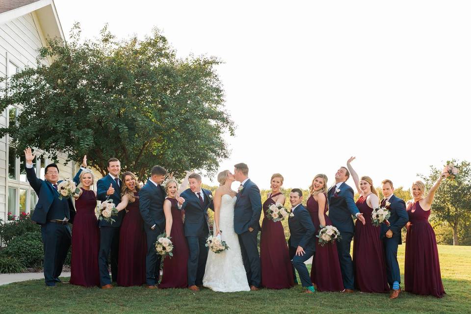 Newlyweds, bridesmaids, and groomsmen