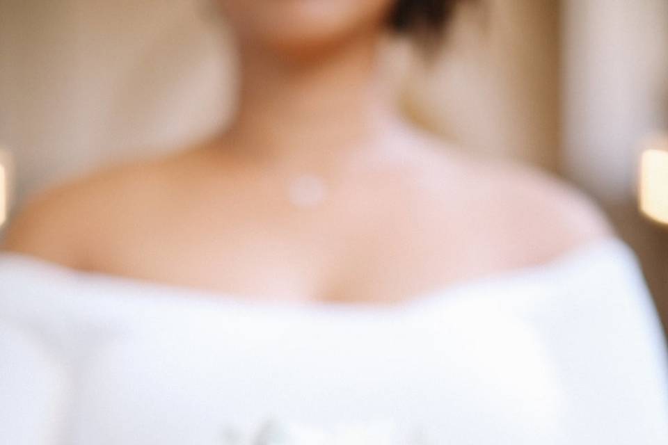Bridal bouquet and off-shoulder dress