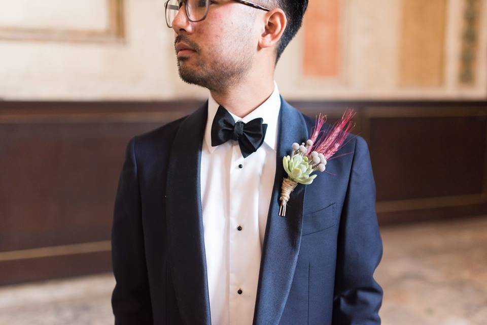 Groom in a tuxedo with boutonniere