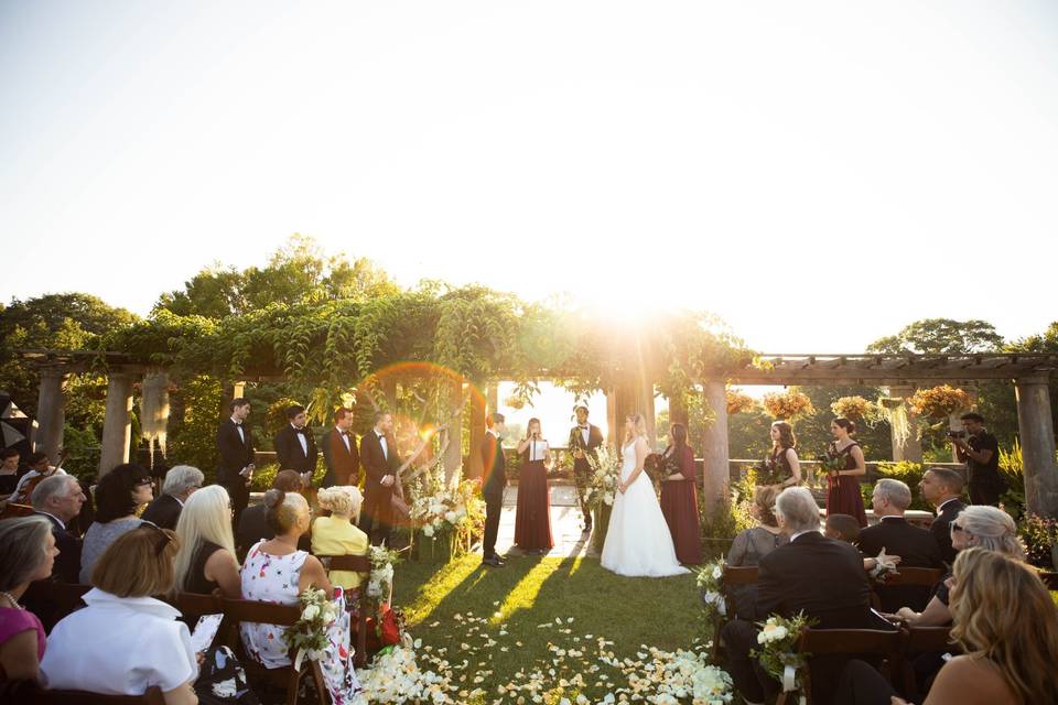 Ceremony at Sunset on lawn