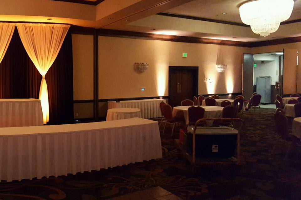 Uplights and drapes behind the head table