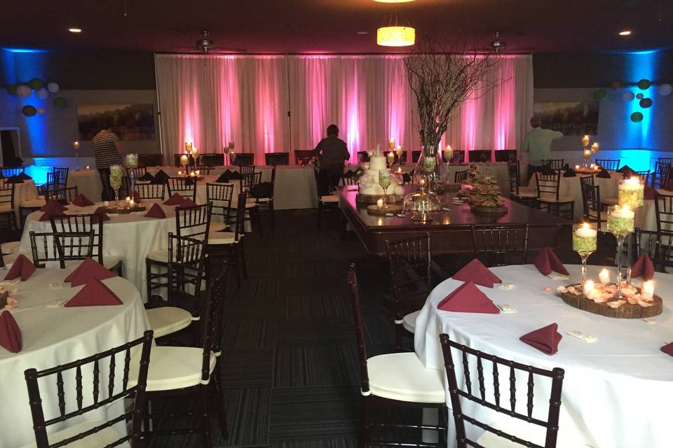 Candlelit tables and reception uplights