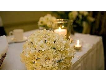 Please visit our website, www.thegardenofedenflowers.com, to view more photos of our actual designs. Photograph courtesy of Reflections Creative Photoraphy.