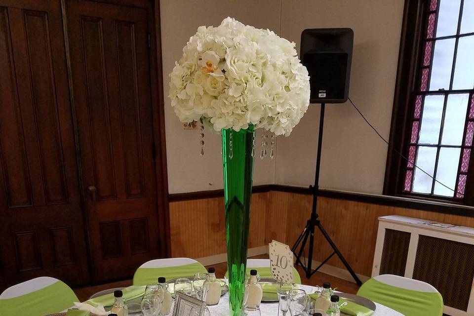Raised floral centerpiece and green accents
