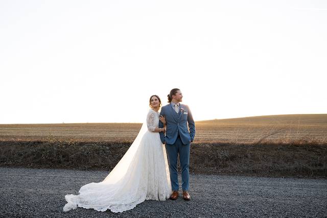 Bride and groom in open field