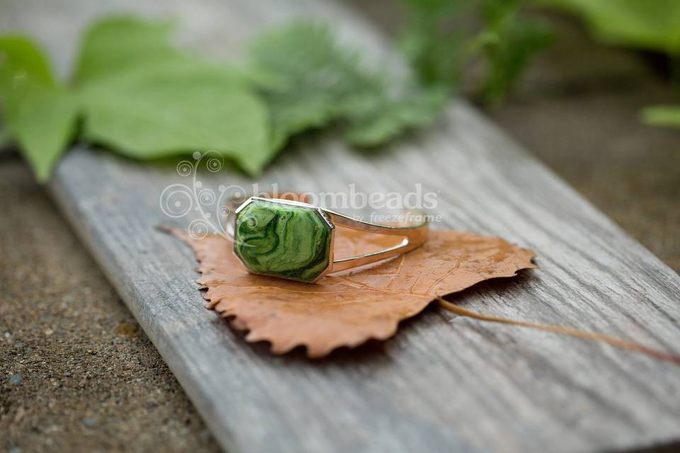 Cuff bracelet with flower petal inlay