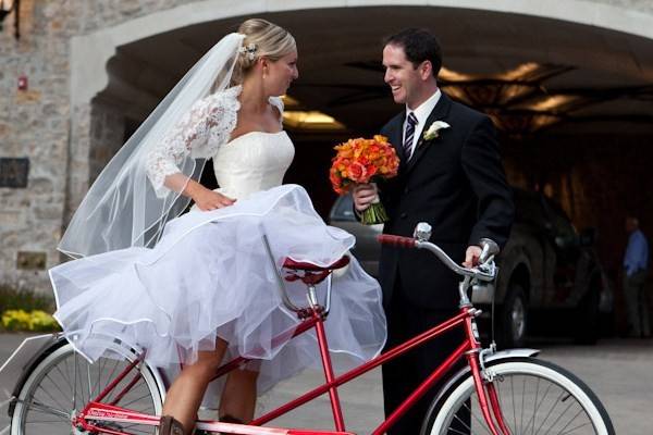 Helping the bride onto the bike