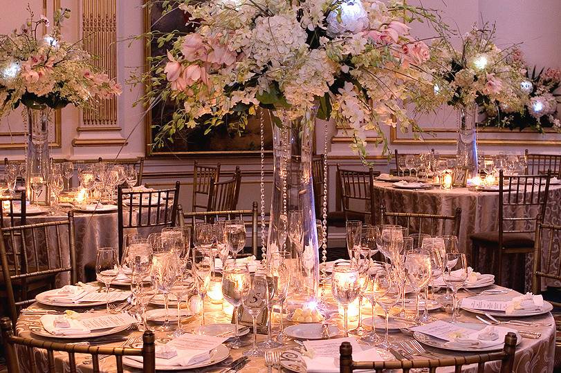 Table setting and raised floral centerpiece