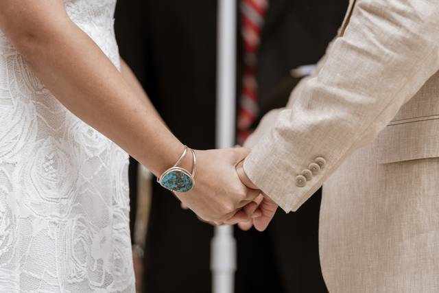 Newlyweds holding hands