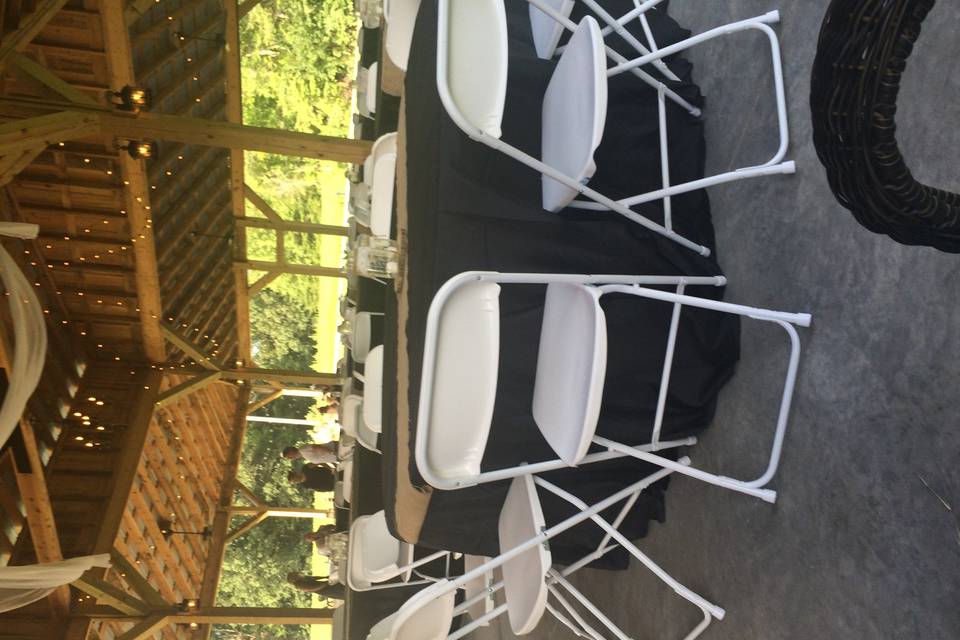 White or black floor length tablecloths INCLUDED in price of rental for reception.