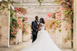 Newlyweds on a floral pathway