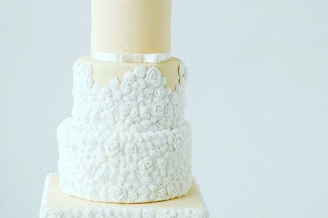 Yellow and white wedding cake