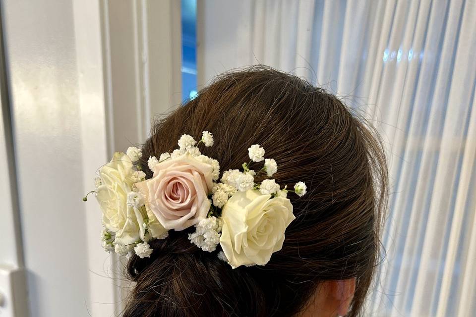 Low bun with floral piece