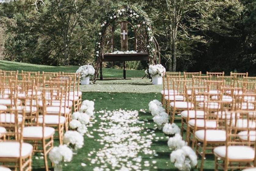 Gold chairs outdoor ceremony