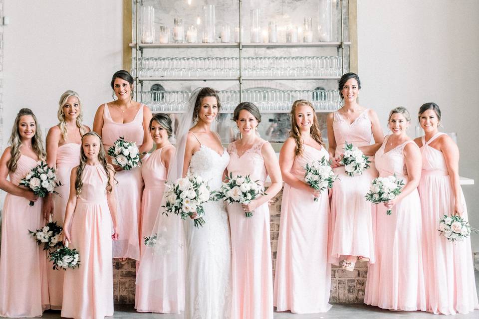 Bridesmaids in pink with the bride