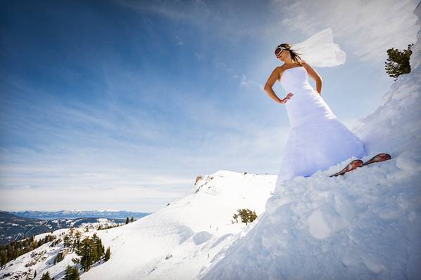 Squaw Valley bride skiing with Lake Tahoe in the background