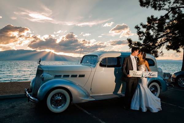 Lake Tahoe wedding with Tahnk You signs at sunset