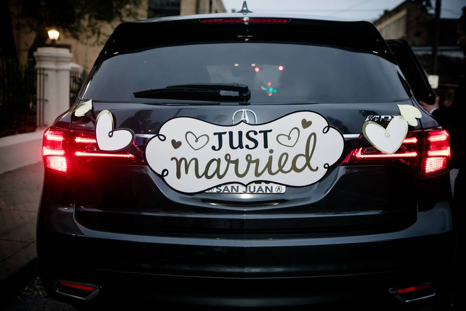 'Just Married' on the back of the wedding car