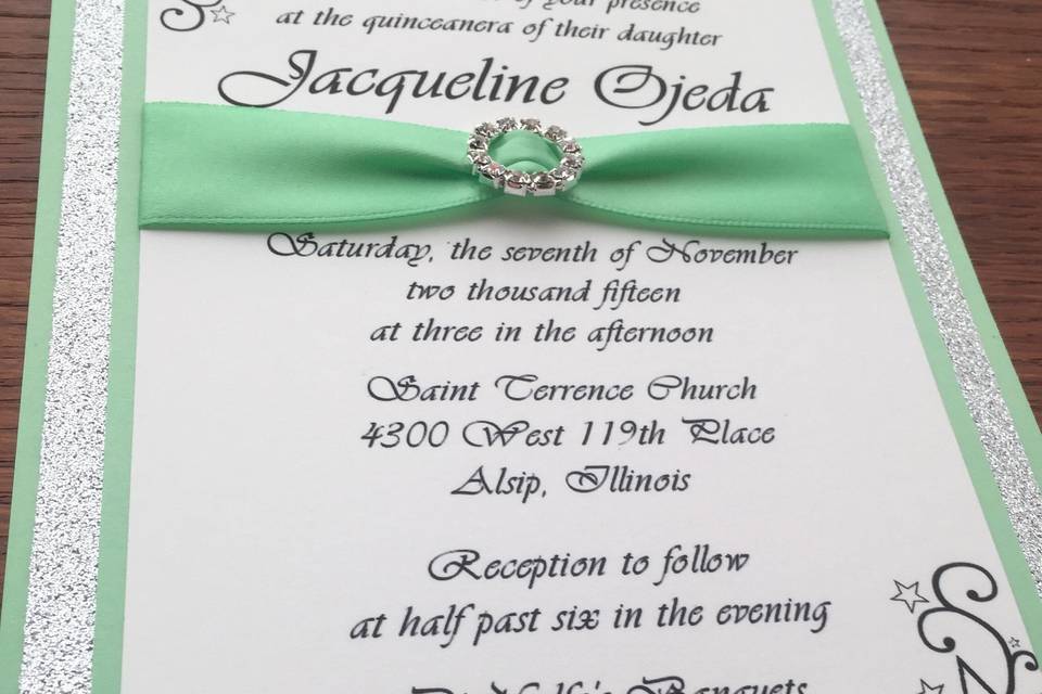 Elegant green ribbon wrap on invitation