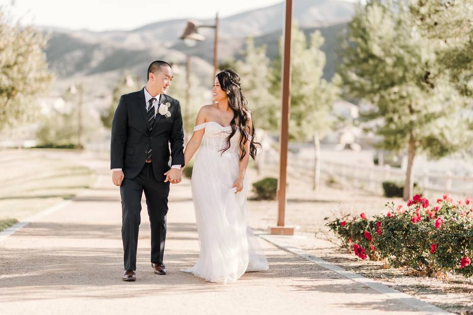 Newlyweds walk through the park